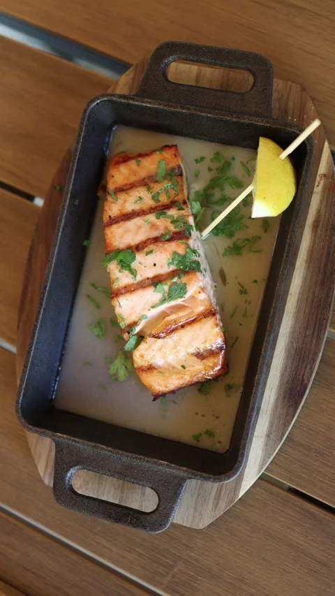 Grilled salmon in herb sauce Stock Footage 337848505