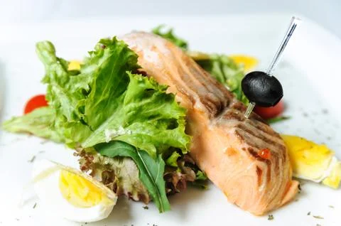 Grilled salmon with lettuce Stock Photos