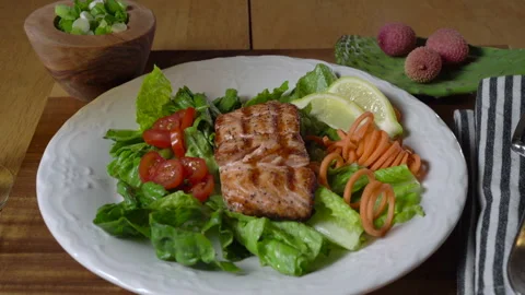 Grilled Salmon with Salad on the side Stock Footage 243579908
