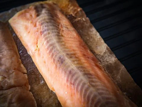 Grilled Salmon on a Salt Plank Stock Photos