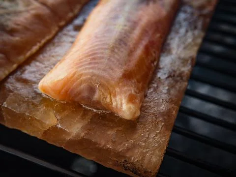 Grilled Salmon on a Salt Plank Stock Photos