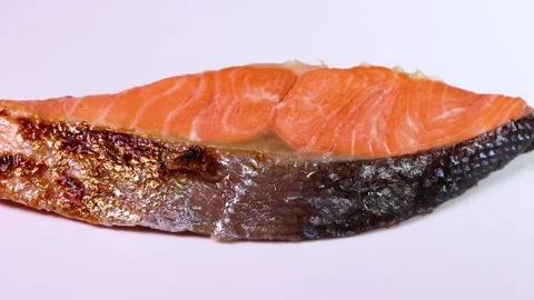 Grilled salmon on white background close up, rotating Stock Footage 308835502
