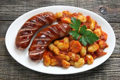 Grilled sausage served with beans Stock Photos