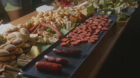 Grilled Sausages, Bread Rolls, Buffet Board, Party Food Stock Footage 345530734