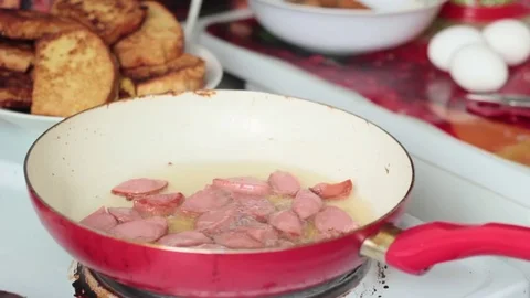 Grilled sausages with eggs in the pan Stock Footage 73561775