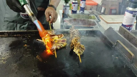 Grilled seafood that is cooked immediately when someone orders it Stock Footage 276593719