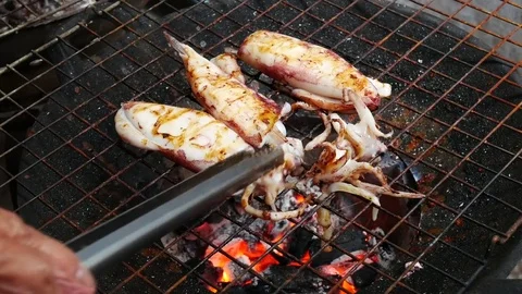 Grilled  seafood on fire Stock Footage 79669642