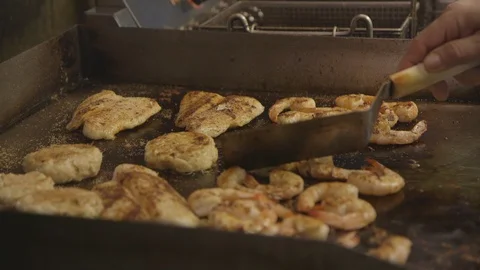 Grilled seafood on a flat top grill Stock Footage 104881892