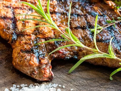 Grilled served t-bone beef steak closeup Stock Photos