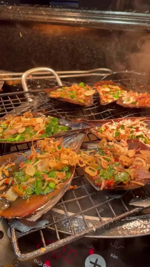 Grilled Shellfish with Fresh Herbs and Crispy Shallots in Hanoi Street Stock-Footage 283628067