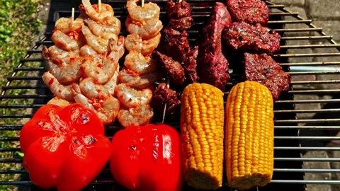 Grilled Shrimp, Beef and Corn on an Outdoor Barbecue Grill Stock Footage 346552463