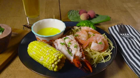 Grilled Shrimp Dip in Butter Stock Footage 243576716