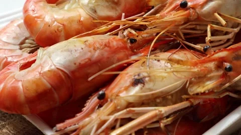 Grilled shrimp in a foam box. Closeup side view. Stock Footage 297961748