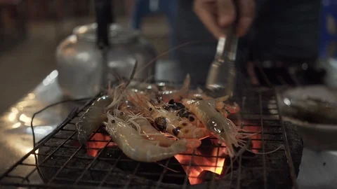 Grilled shrimp on the grill using a charcoal stove. Stock Footage 90094754