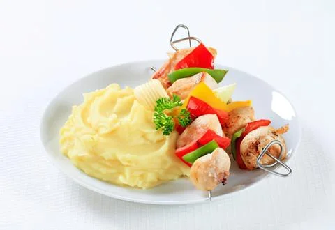 Grilled skewer with veggies and mashed potatoes Stock Photos