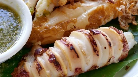 Grilled squid with sauce Stock Footage 84267402