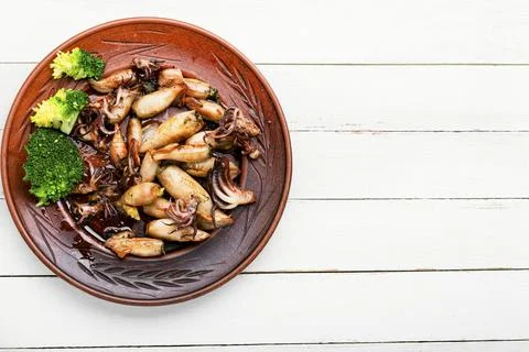 Grilled squids in plate Stock Photos