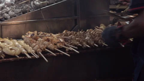 Grilled squids preparing for customer. Stock Footage 163944463