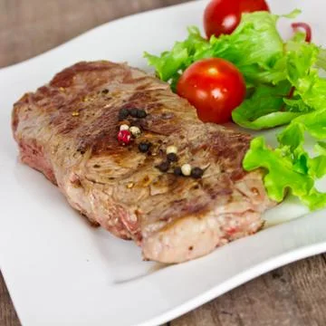 Grilled steak and salad Stock Photos