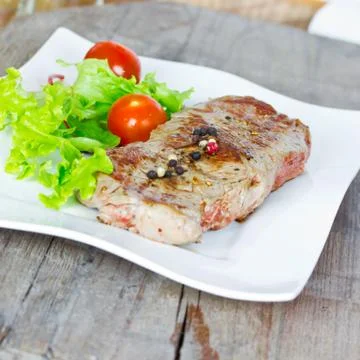 Grilled steak and salad Stock Photos