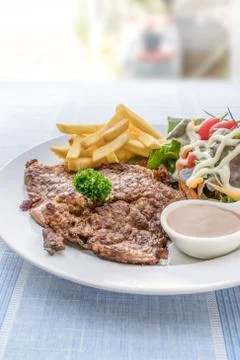 Grilled steak on dish Fotos Stock