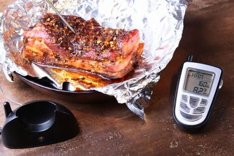 Grilled Steak in a pan and Wireless Remote Digital Cooking Food Probe Meat Stock Photos