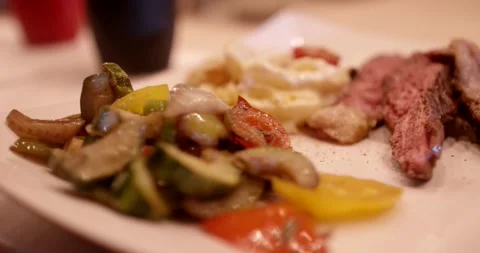 Grilled Steak with Roasted Vegetables and Cheese, Gourmet Plate, Macro Shot Stock Footage 340323047