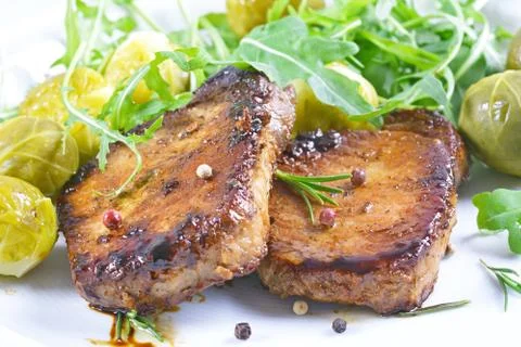 Grilled steaks and vegetables. Stock Photos