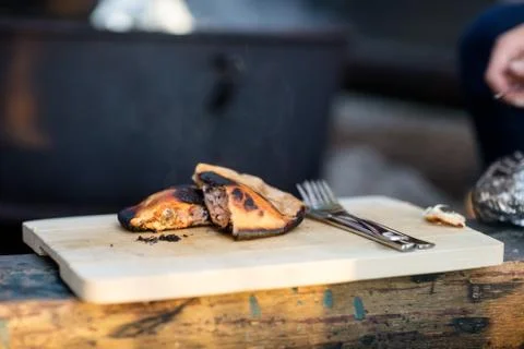 Grilled Stuffed Bread On Cutting Board In Forest Stock Photos