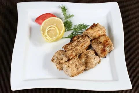Grilled succulent meat with vegetables Stock Photos
