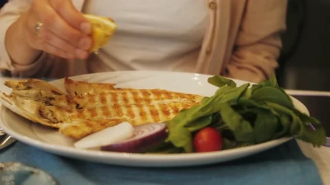 Grilled tasty white fish on white plate with vegetables Stock Footage 197215218