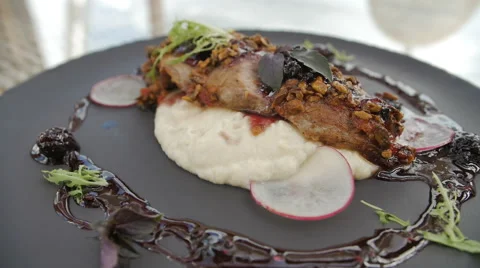 Grilled turkey spins on dish with potato, herbs, nuts and redish served with Video stock 67354586