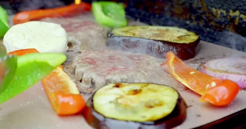 Grilled Vegetables and Meat Cooking on a Barbecue Stock Footage 323334809