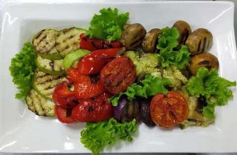 Grilled vegetables on a white rectangular plate Stock Photos