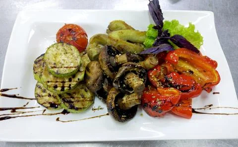 Grilled vegetables on a white rectangular plate Stock Photos