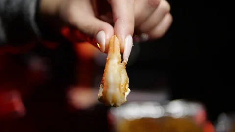Grilled wings in the foreground. Selective focus on delicious chicken meat baked Stock Footage 127541733