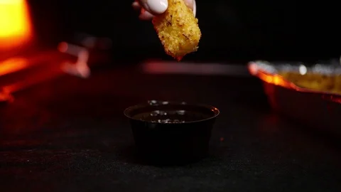 Grilled wings in the foreground. Selective focus on delicious chicken meat baked Video stock 127541878