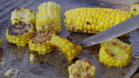 Grilled young corn in boiling butter Stock Footage 140146062