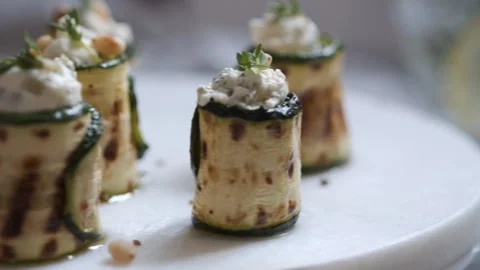 Grilled zucchini rolls stuffed with cream cheese, pickles and herbs Stock Footage 101355017