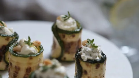 Grilled zucchini rolls stuffed with cream cheese, pickles and herbs Stock Footage 101355212