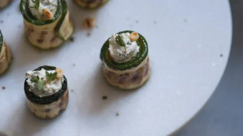 Grilled zucchini rolls stuffed with cream cheese, pickles and herbs Stock Footage 101355354