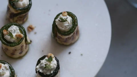 Grilled zucchini rolls stuffed with cream cheese, pickles and herbs Stock Footage 101355586