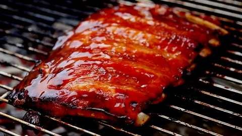 Grilling and brushing ribs Stock Footage 88060726