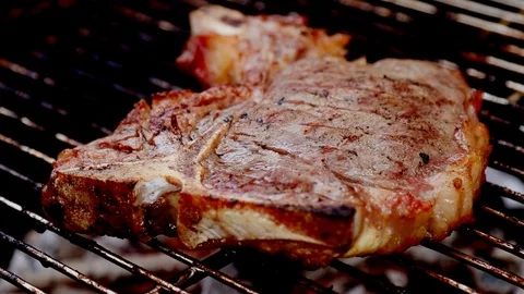 Grilling and flipping steak Stock Footage 88060724