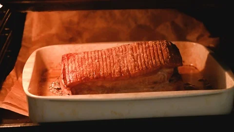 Grilling and roasting pork with crispy crust in oven Stock Footage 116226599
