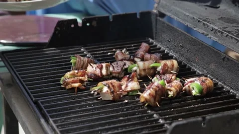 Grilling bacon wrapped meat Stock Footage 214018147