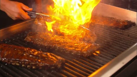 Grilling bbq ribs on grill for a bbq  bar b que restaurant american business Video stock 72708136