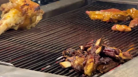 Grilling Beef Over Charcoal Asian Street Food in Cambodia Stock Footage 336430177