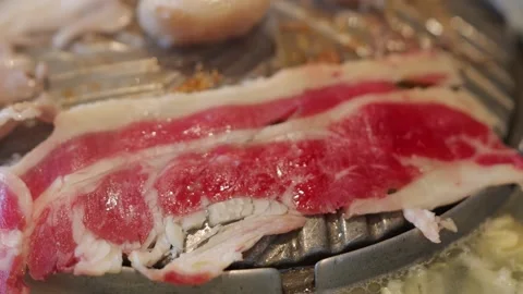 Grilling Beef on Thai BBQ Hot Pot Stock Footage 344399332
