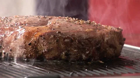 Grilling beefsteak on an electric grill 스톡 동영상 24634109